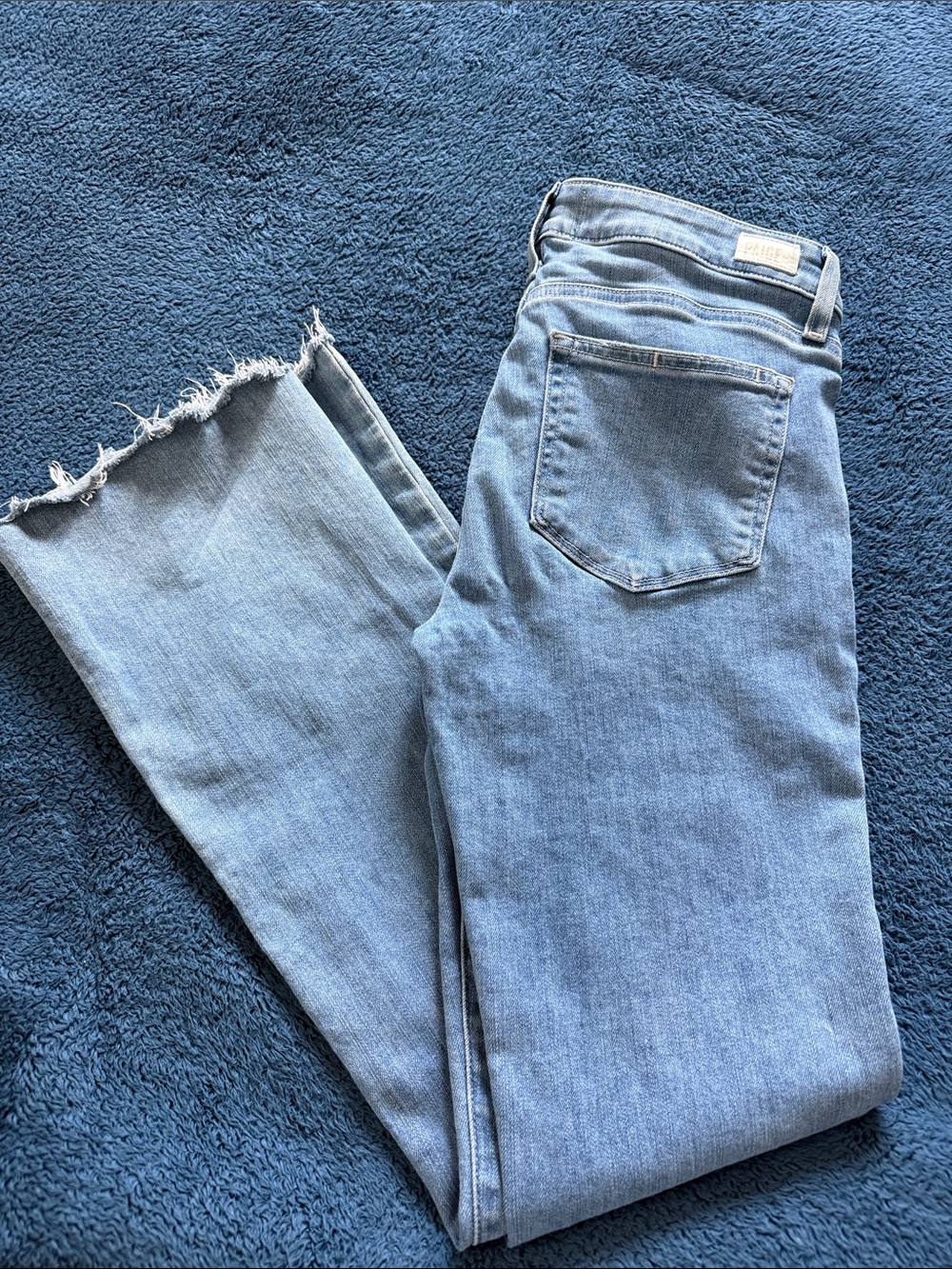PAIGE Light Blue High-Rise Flare Jeans with Frayed Hem